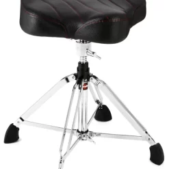 The Gibraltar 9908 Drum Throne gives you supreme comfort at your kit. Featuring a sturdy 4-post base, you can feel secure atop your perch as you keep time with your band or track drums in the studio. For those marathon playing sessions, the 9908 Drum Throne offers you an oversized, 17" motorcycle-style seat with contoured lower lumbar support. Why should you be uncomfortable while sitting behind your drum set? If you're looking to add some comfort to your kit, turn to the Gibraltar 9908 Drum Throne.